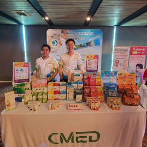 CMED Products display booth at the 'Moving Forward with Title Pharmacy' event held at Ramada Plaza Chao Fah, Phuket on September 15, 2024 บูธแสดงสินค้าของ CMED Products ในงาน 'Moving Forward with Title Pharmacy' ณ โรงแรมรามาดา พลาซ่า เจ้าฟ้า จ.ภูเก็ต วันที่ 15 กันยายน 2567
